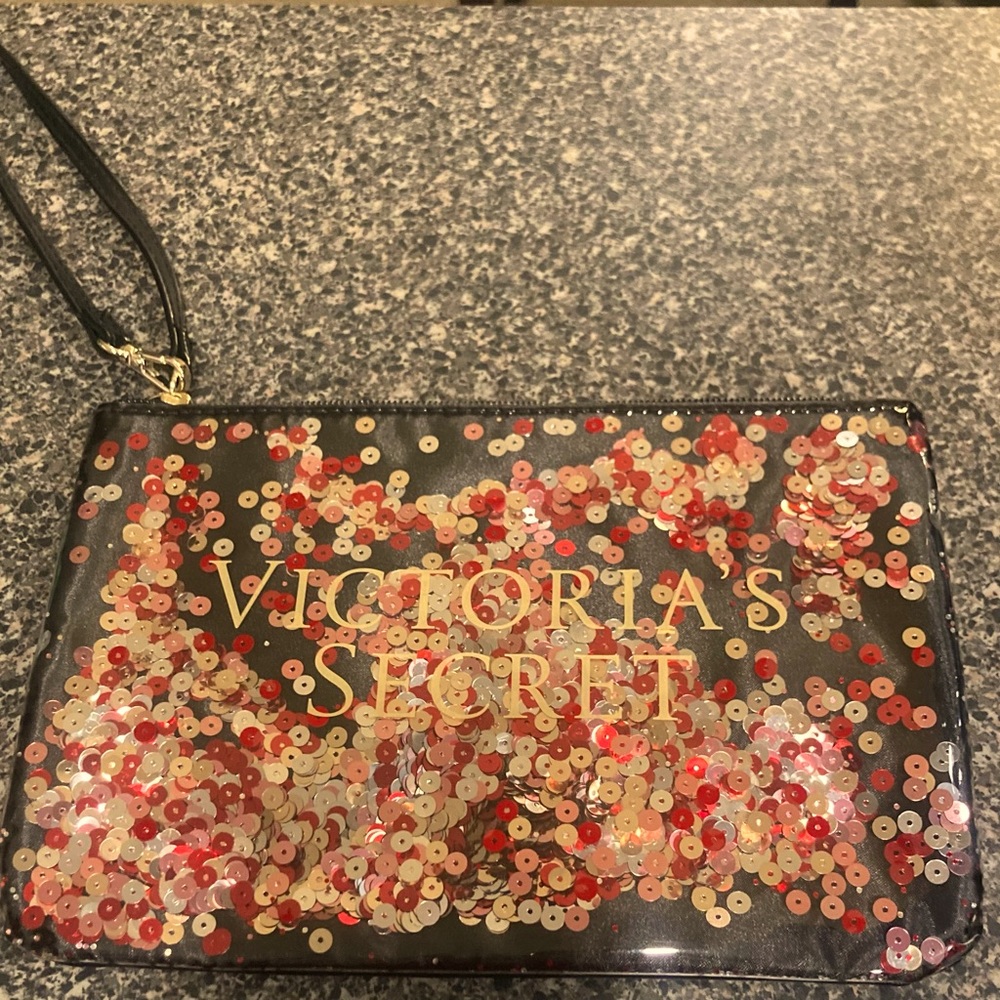 Victoria’s Secret wristlet with red and gold sequins